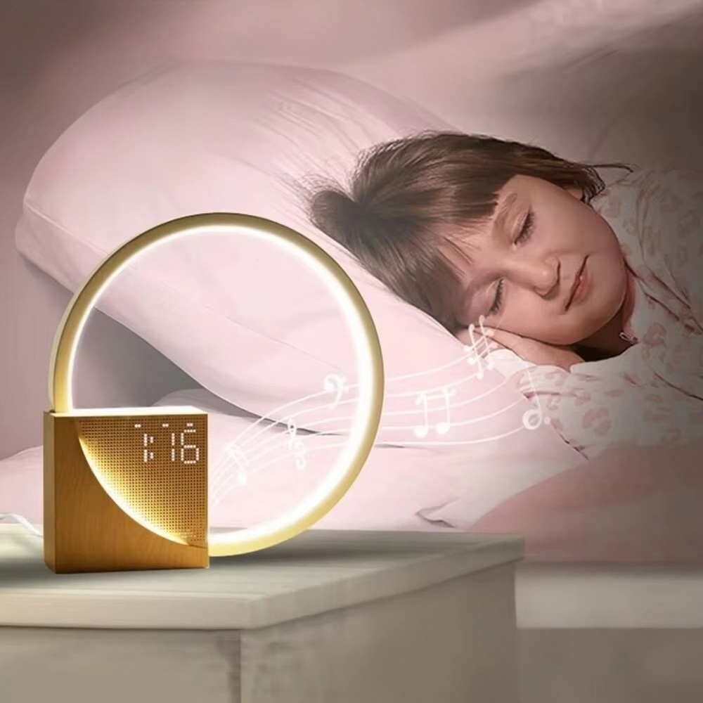 Woman sleeping with a gold circular night light on a bedside table