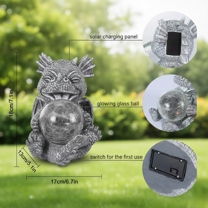 A solar-powered garden dragon statue holding a glowing glass ball. The image includes a dimension guide showing the statue is 18cm (7.1 in) tall and 17cm (6.7 in) wide. Three inset circles highlight product features: the solar charging panel on the back, the crackled glowing glass ball, and the on/off power switch located at the base.
