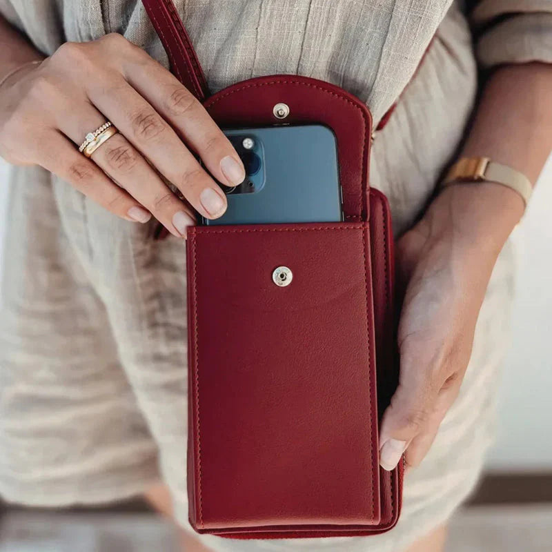 Red phone case held by a person with a neutral background
