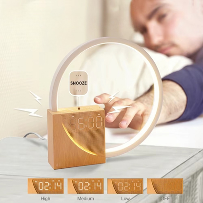 Wooden alarm clock with light feature on a bed, showing snooze button and time display.