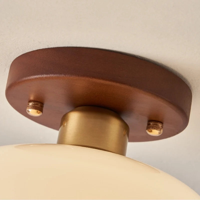 the wood base of the glass ceiling lamp