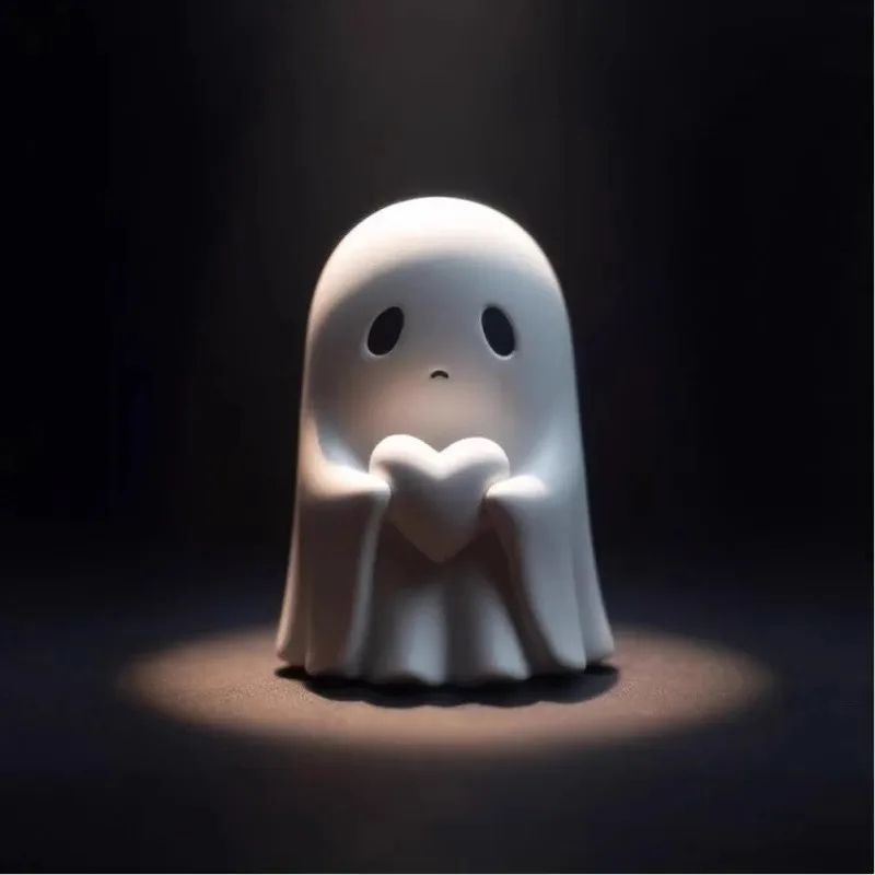 White ghost figurine holding a heart