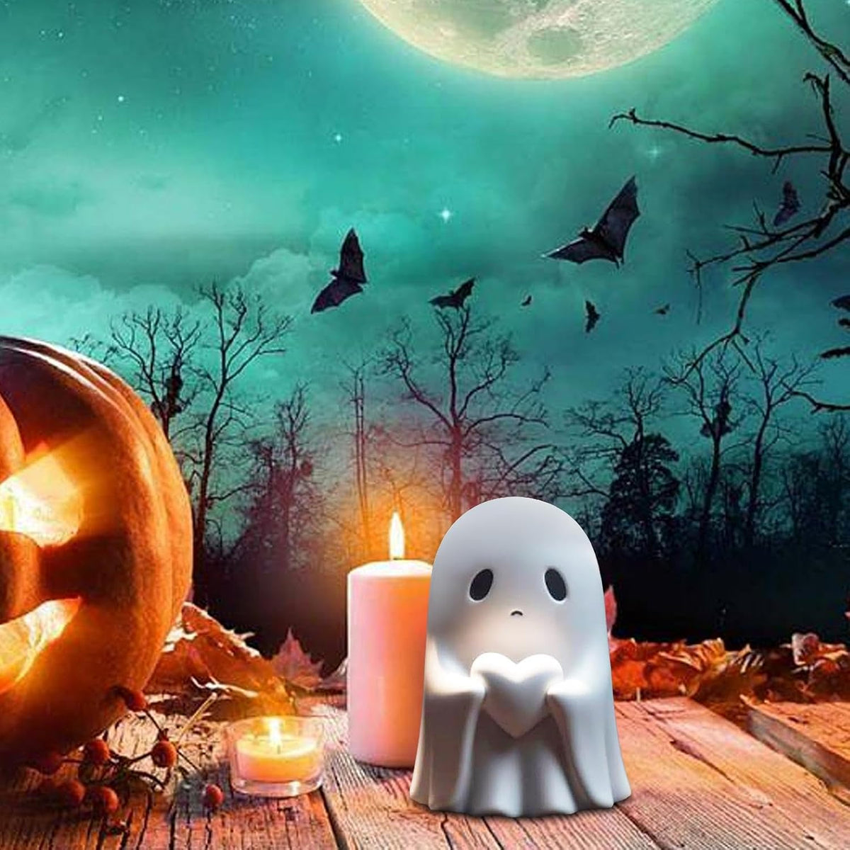 Ghost figurine with heart in a Halloween scene