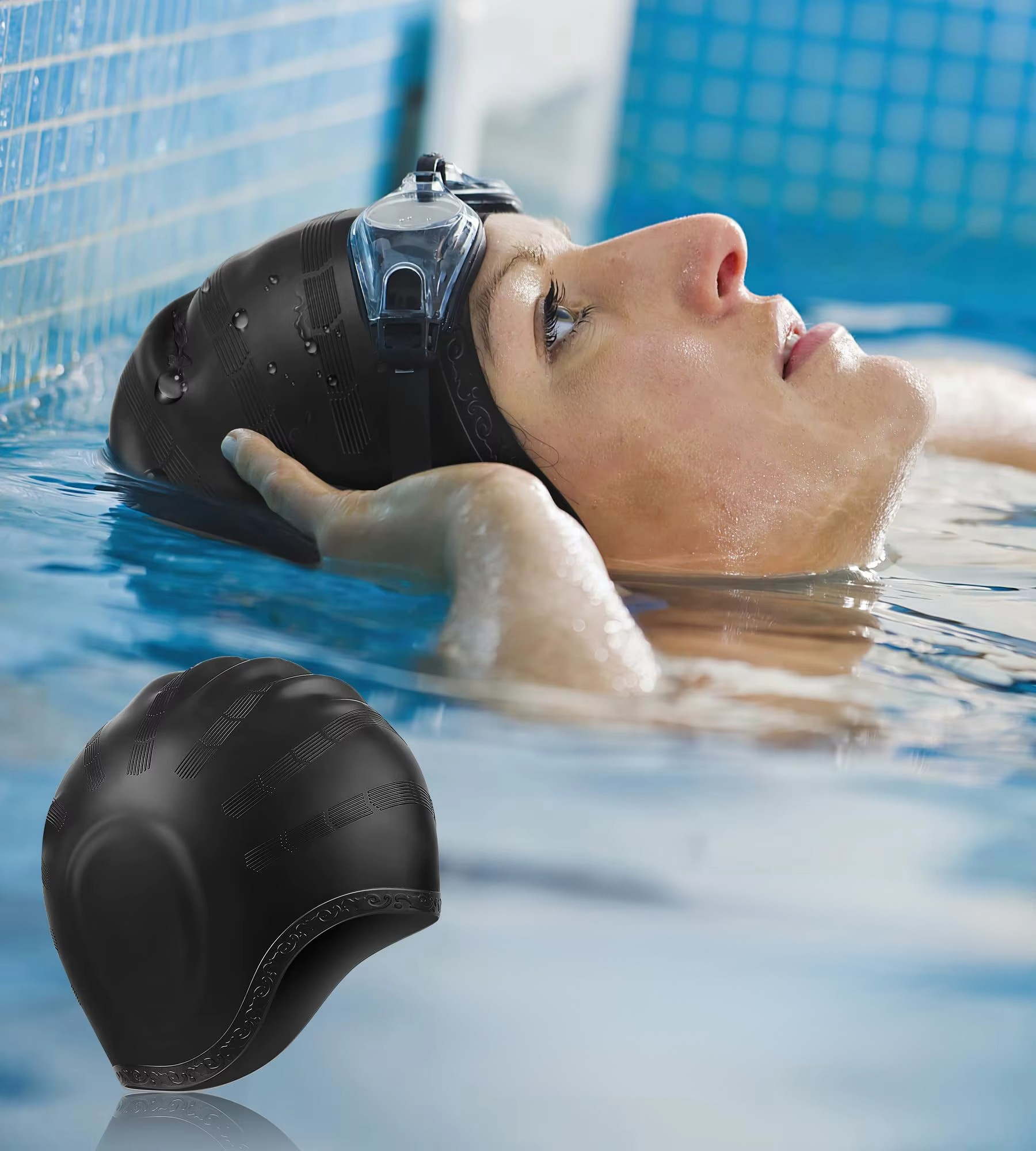 Person wearing a black swim cap in a pool