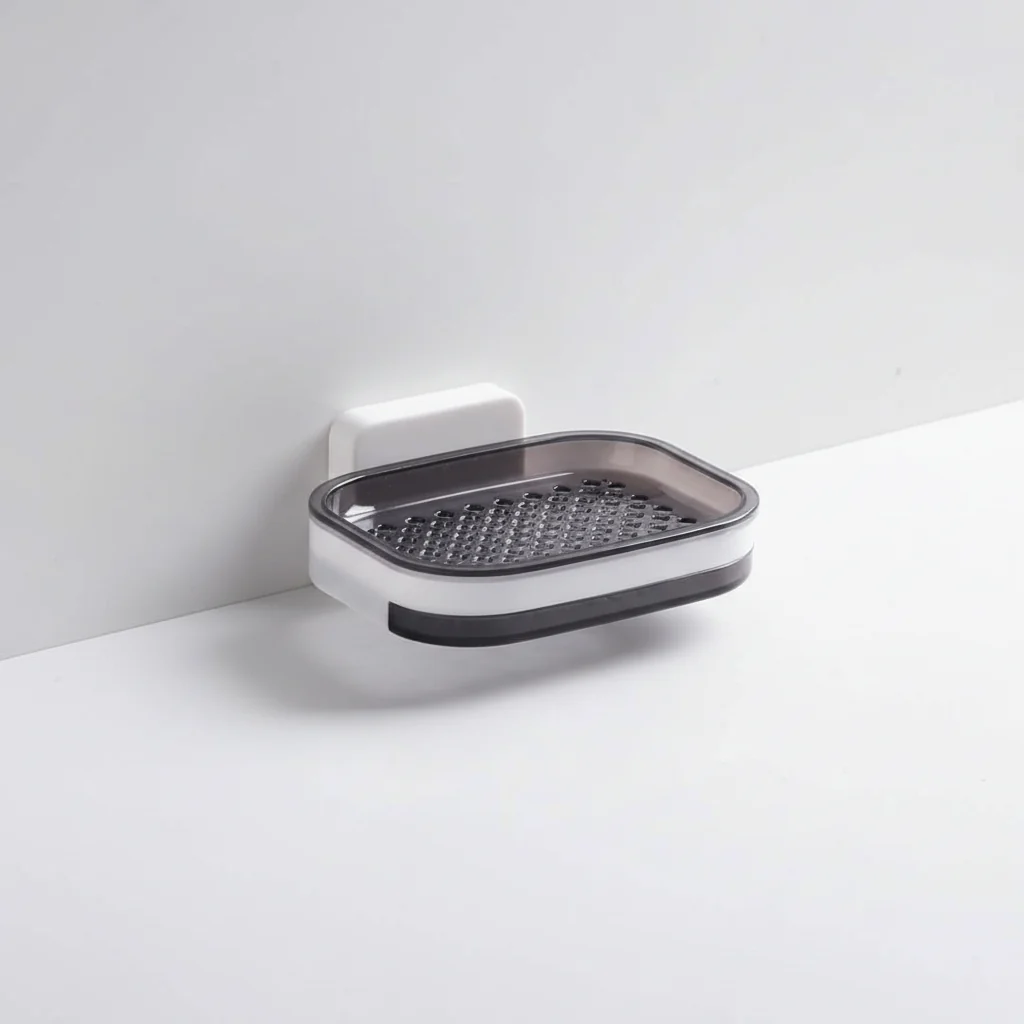 Wall-mounted soap dish with textured surface on a white background