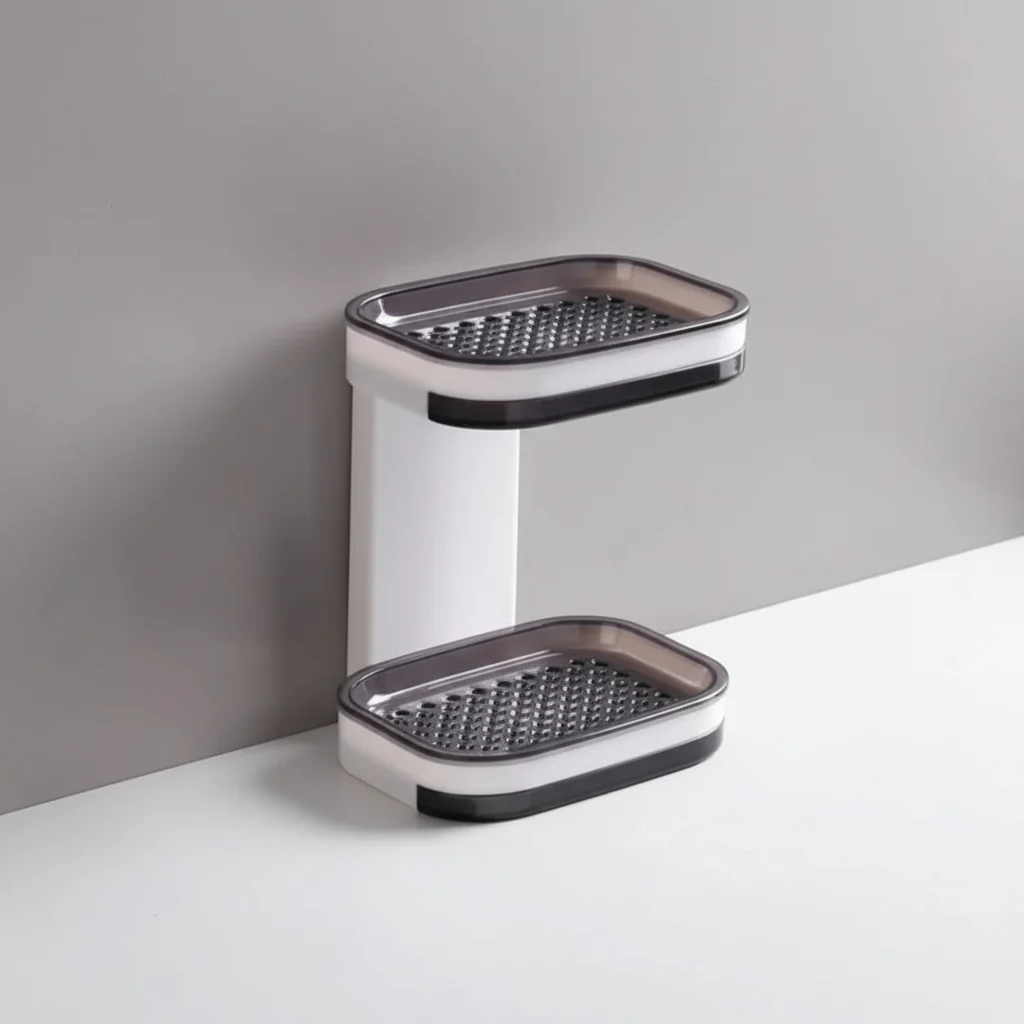Two-tiered metal shelf with grates on a gray background