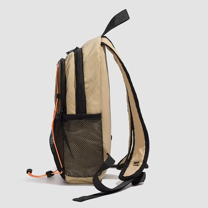 Beige backpack with black straps on a light gray background