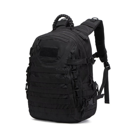 Black tactical backpack with visible branding on a white background